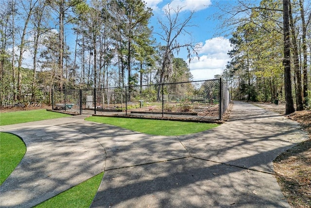 view of home's community featuring a yard