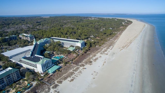 bird's eye view with a water view and a beach view