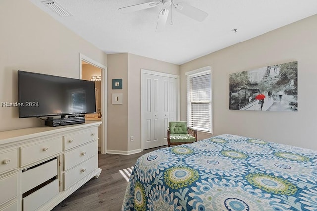 bedroom featuring dark hardwood / wood-style flooring, a closet, and ceiling fan