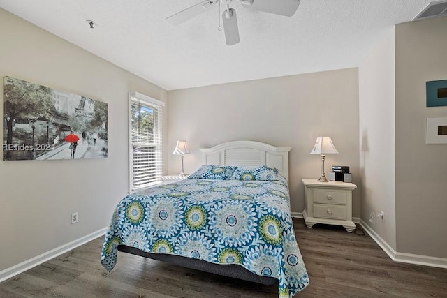 bedroom featuring dark hardwood / wood-style flooring and ceiling fan