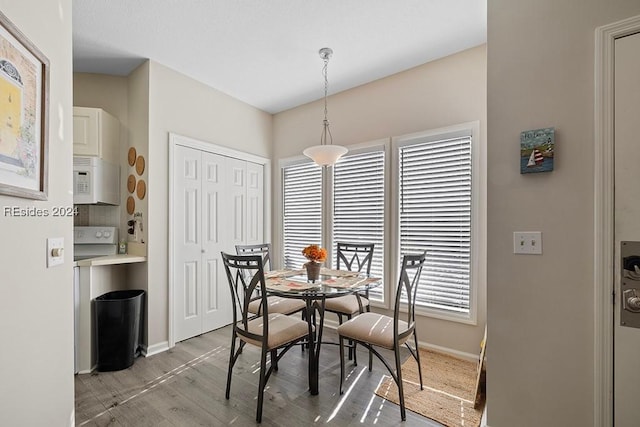 dining area featuring plenty of natural light and light wood-type flooring