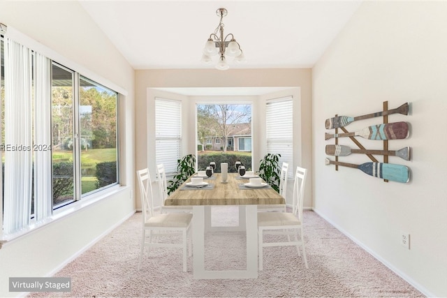 sunroom featuring a chandelier