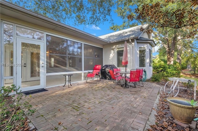 view of patio / terrace with a sunroom