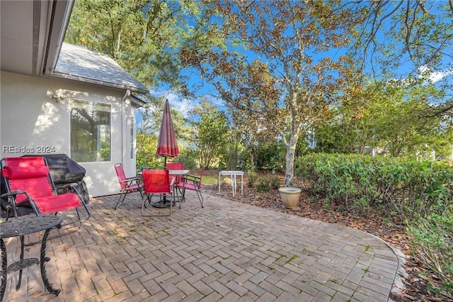 view of patio featuring a grill