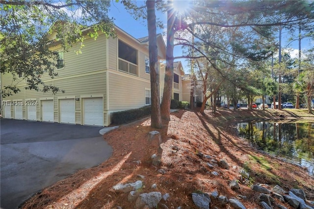 view of property exterior with a garage