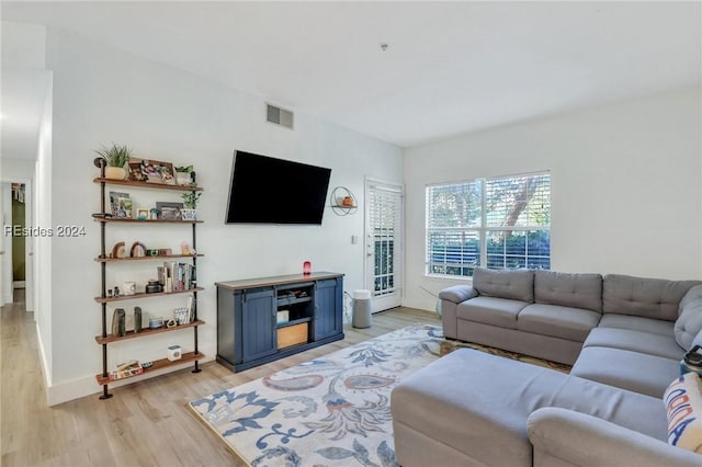 living room with light hardwood / wood-style floors