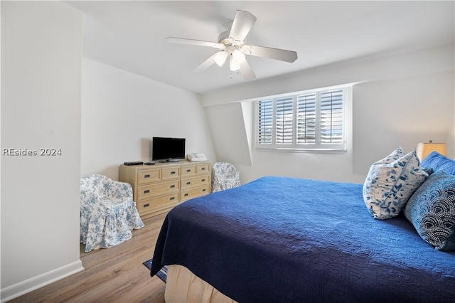 bedroom featuring light wood-type flooring and ceiling fan