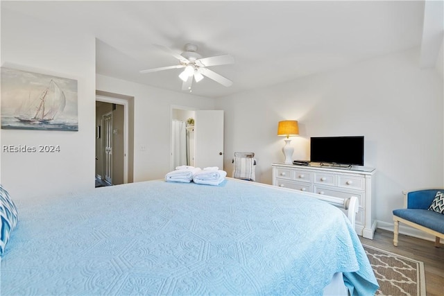 bedroom with hardwood / wood-style flooring and ceiling fan