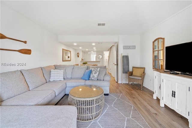 living room with light hardwood / wood-style floors