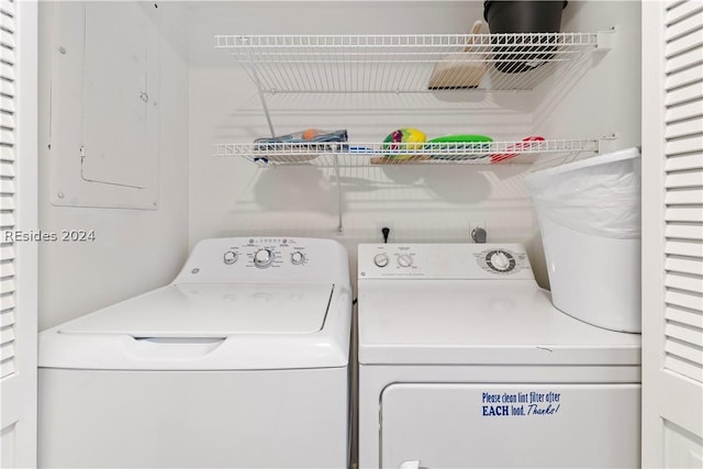 laundry area with washing machine and clothes dryer