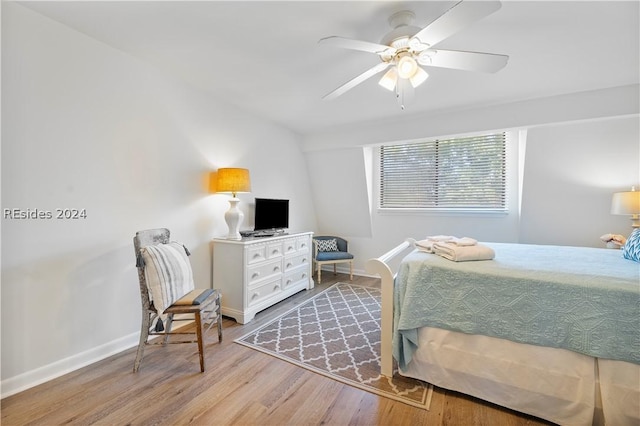 bedroom with ceiling fan and light hardwood / wood-style flooring