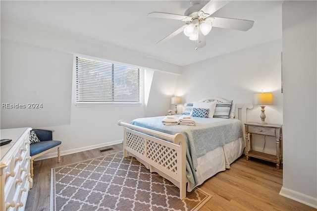 bedroom featuring ceiling fan and wood-type flooring