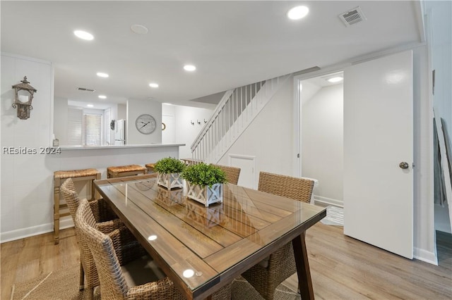 dining area with light hardwood / wood-style flooring