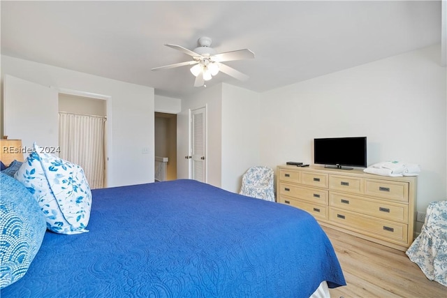 bedroom featuring ceiling fan and light hardwood / wood-style floors