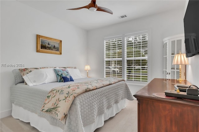 carpeted bedroom with ceiling fan