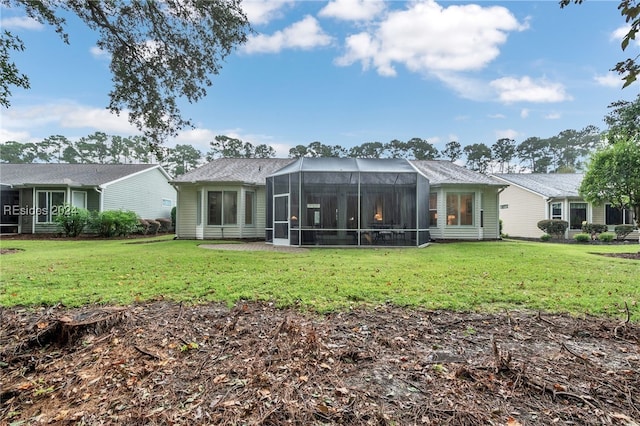 back of house with a yard and a lanai