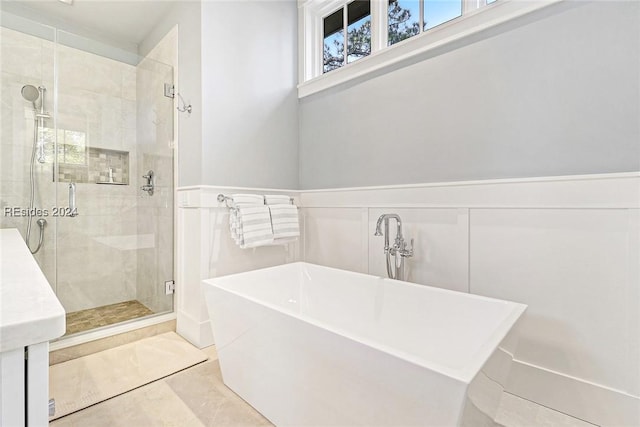 bathroom featuring tile patterned flooring and independent shower and bath