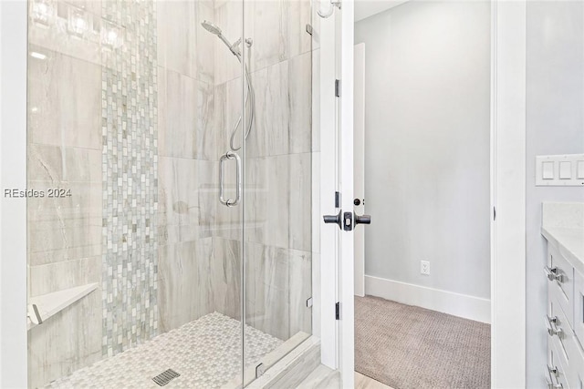 bathroom with a shower with door