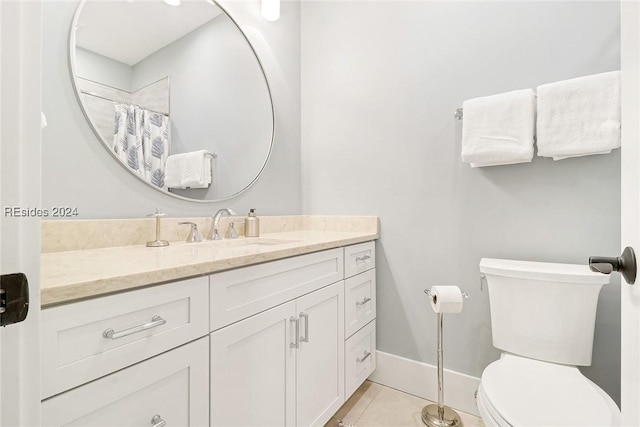 bathroom featuring vanity, tile patterned flooring, a shower with curtain, and toilet