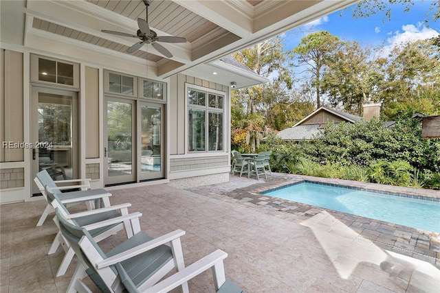 view of pool with a patio and ceiling fan