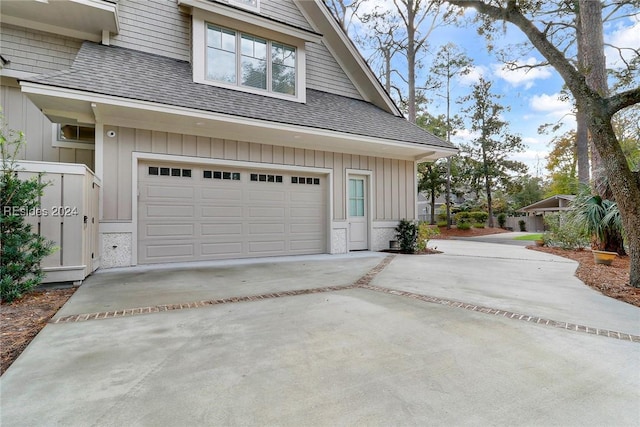 view of side of home with a garage