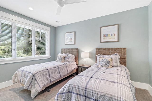 carpeted bedroom with ceiling fan