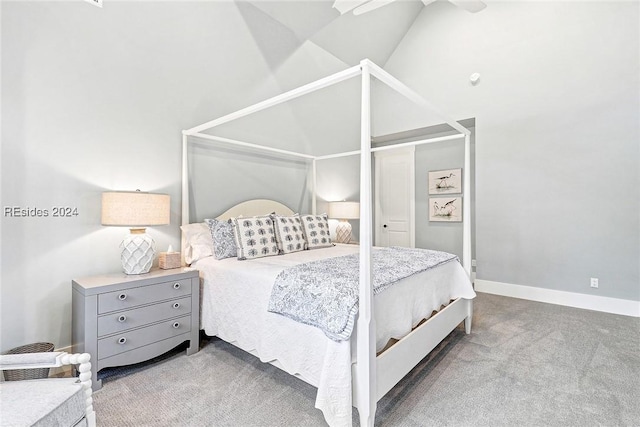 bedroom with ceiling fan, lofted ceiling, and light carpet