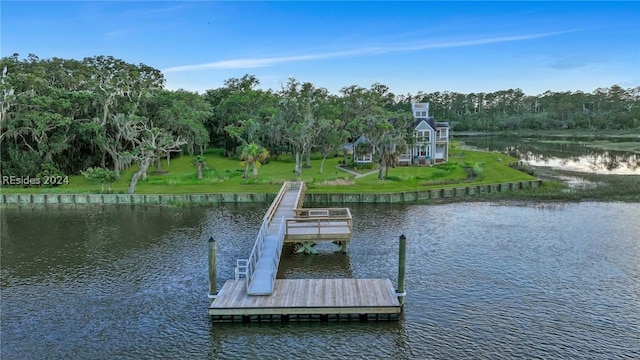 view of dock featuring a water view and a lawn