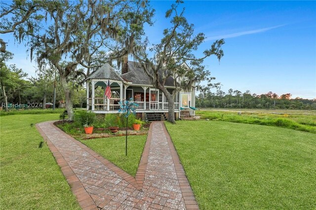 exterior space featuring a gazebo and a yard