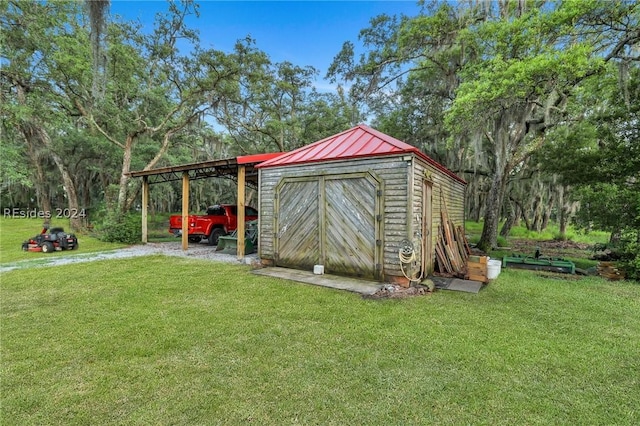 view of outbuilding with a lawn