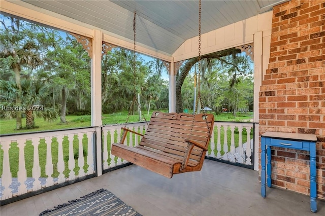 sunroom / solarium with lofted ceiling