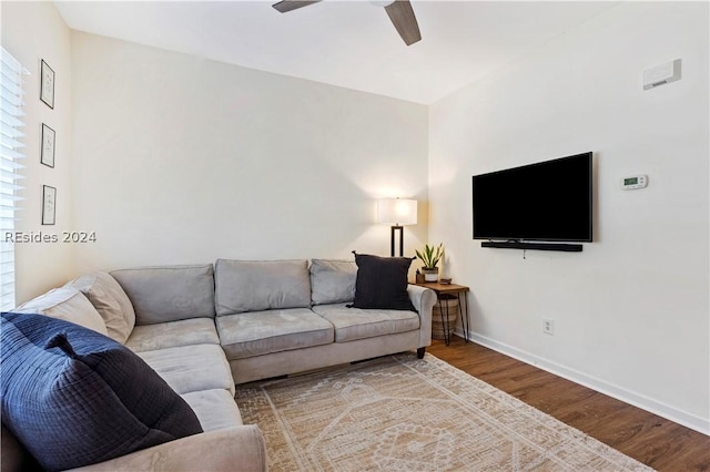 living room with hardwood / wood-style flooring and ceiling fan