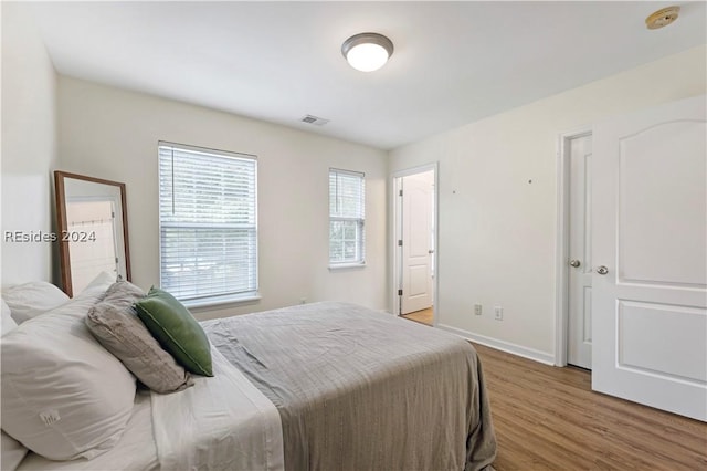 bedroom with wood-type flooring