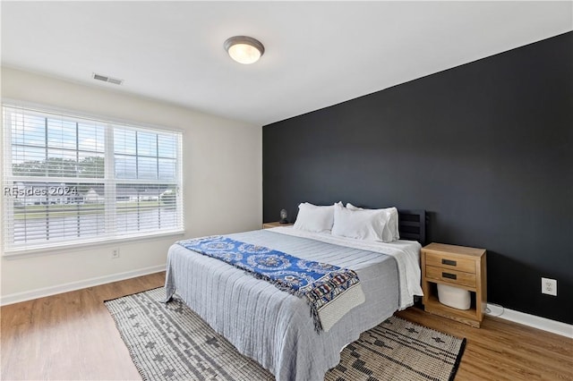 bedroom featuring hardwood / wood-style flooring