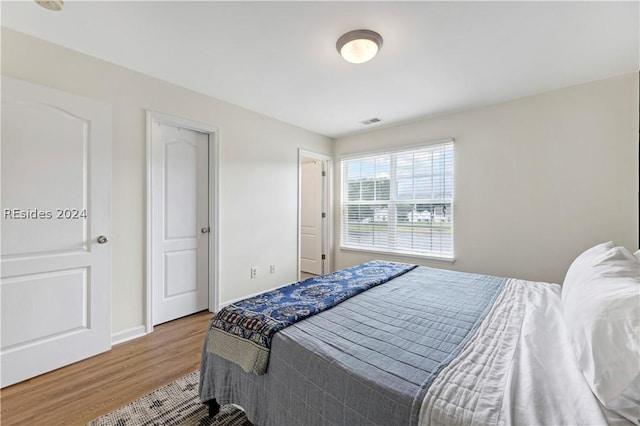 bedroom featuring wood-type flooring