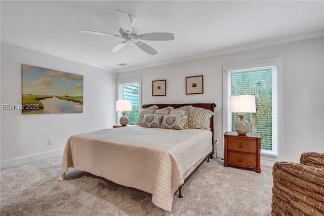 carpeted bedroom featuring multiple windows, ornamental molding, and ceiling fan