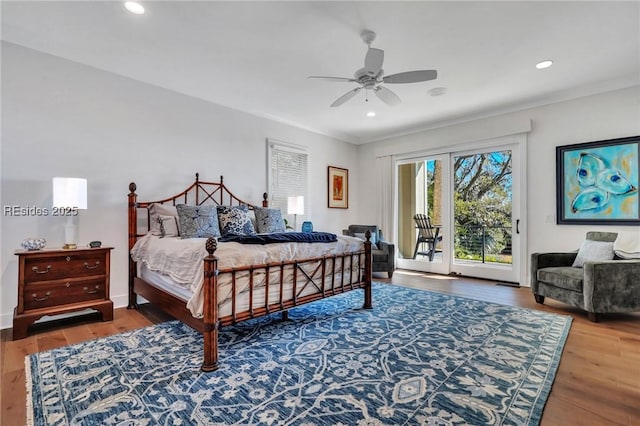 bedroom with wood-type flooring, access to exterior, and ceiling fan