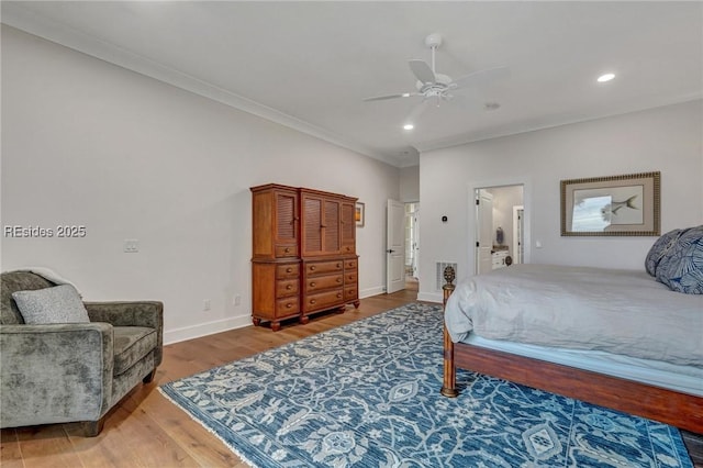 bedroom with wood-type flooring, ornamental molding, and ceiling fan