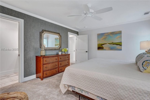 carpeted bedroom with crown molding and ceiling fan