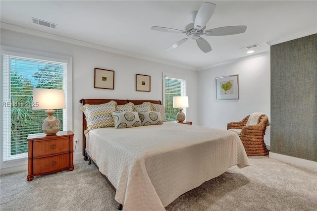 bedroom with crown molding, ceiling fan, multiple windows, and light carpet