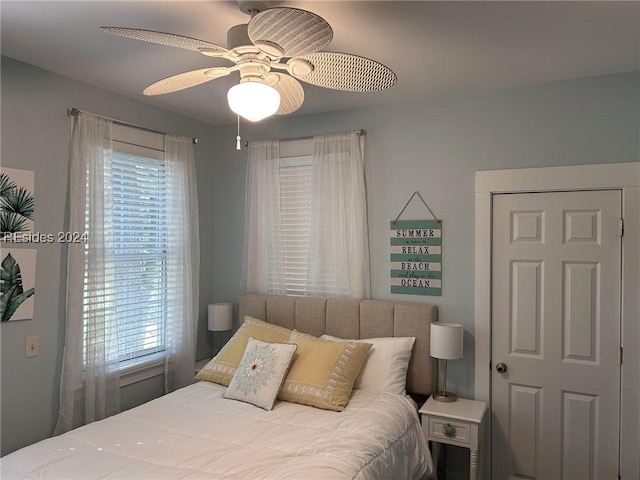 bedroom featuring ceiling fan and multiple windows