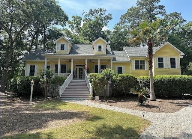 cape cod-style house featuring ceiling fan and a porch