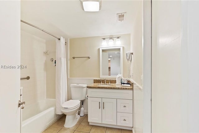 full bathroom featuring tile patterned flooring, vanity, toilet, and shower / bath combo