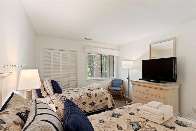 bedroom featuring a closet and carpet flooring