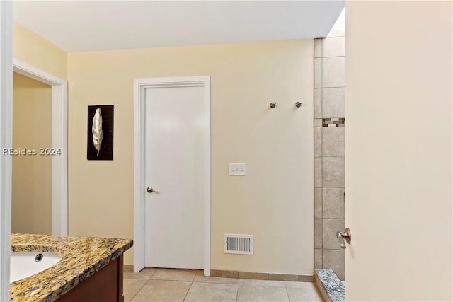 bathroom featuring tile patterned floors and vanity