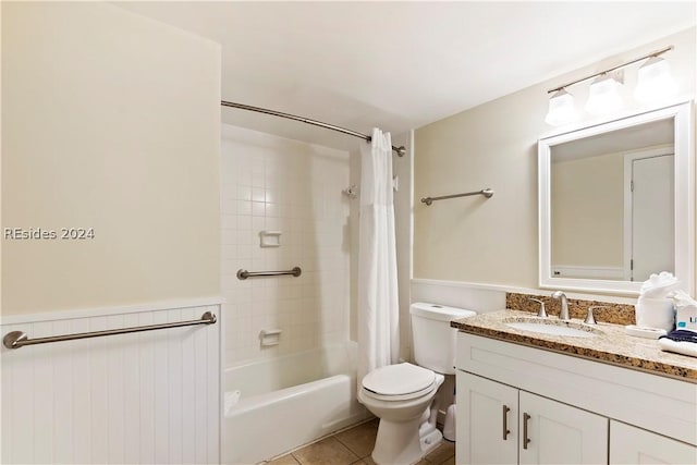 full bathroom with tile patterned flooring, vanity, toilet, and shower / bath combo with shower curtain