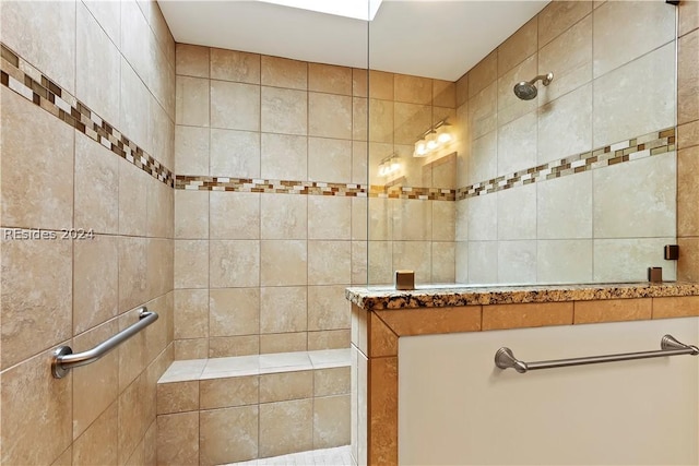 bathroom featuring a tile shower