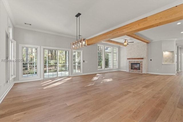 unfurnished living room featuring light hardwood / wood-style flooring, ceiling fan, beam ceiling, a fireplace, and ornamental molding