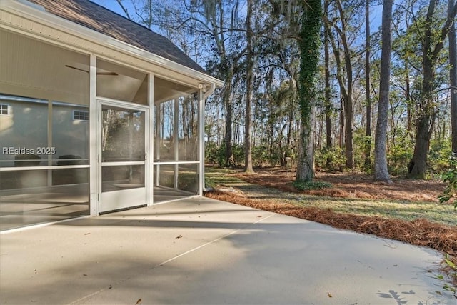 view of patio with a sunroom