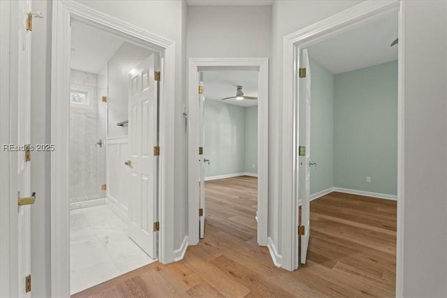 hallway with light wood-type flooring